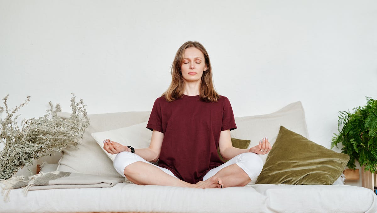 Person practicing Vipassana meditation in a serene environment